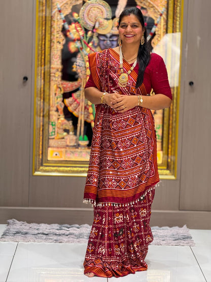 Maroon Festive Patola Saree with Mirror Work & Tassels