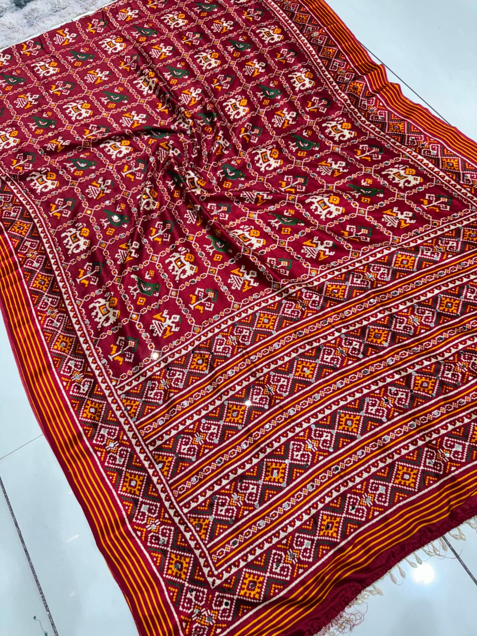 Maroon Festive Patola Saree with Mirror Work & Tassels