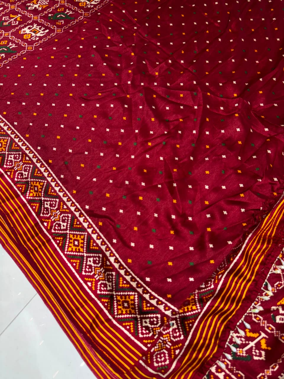 Maroon Festive Patola Saree with Mirror Work & Tassels